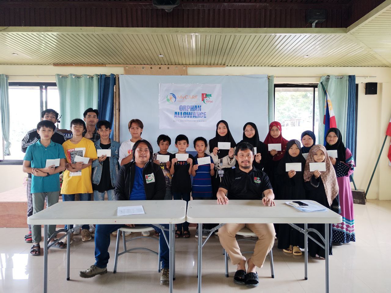 PHILCARE supported orphans and students gathered together during a educational sponsorship program.